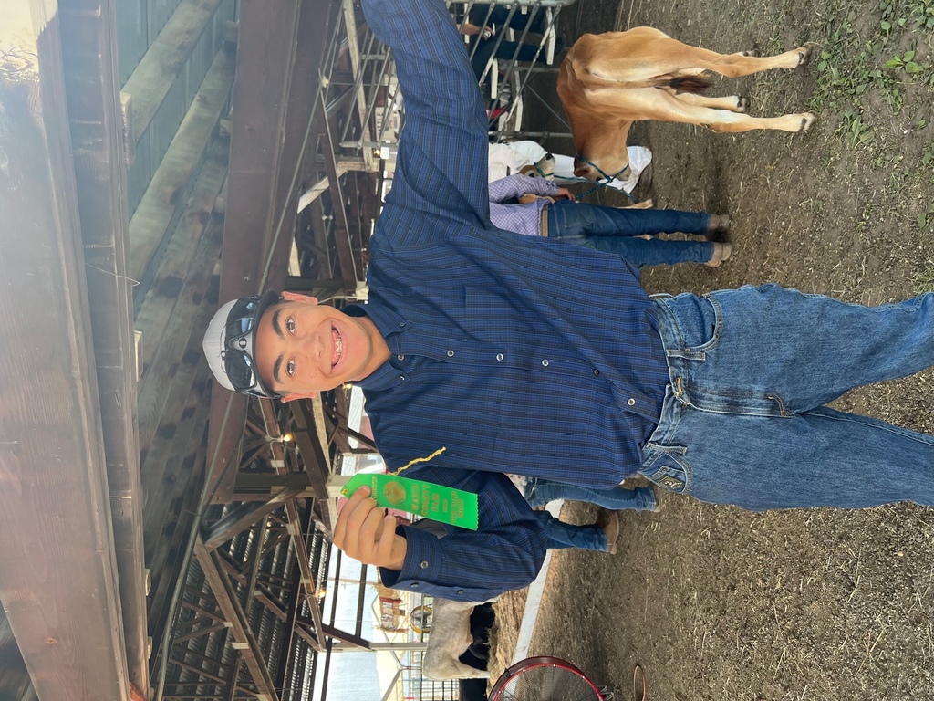 Jordan in the beef barn with his ribbon