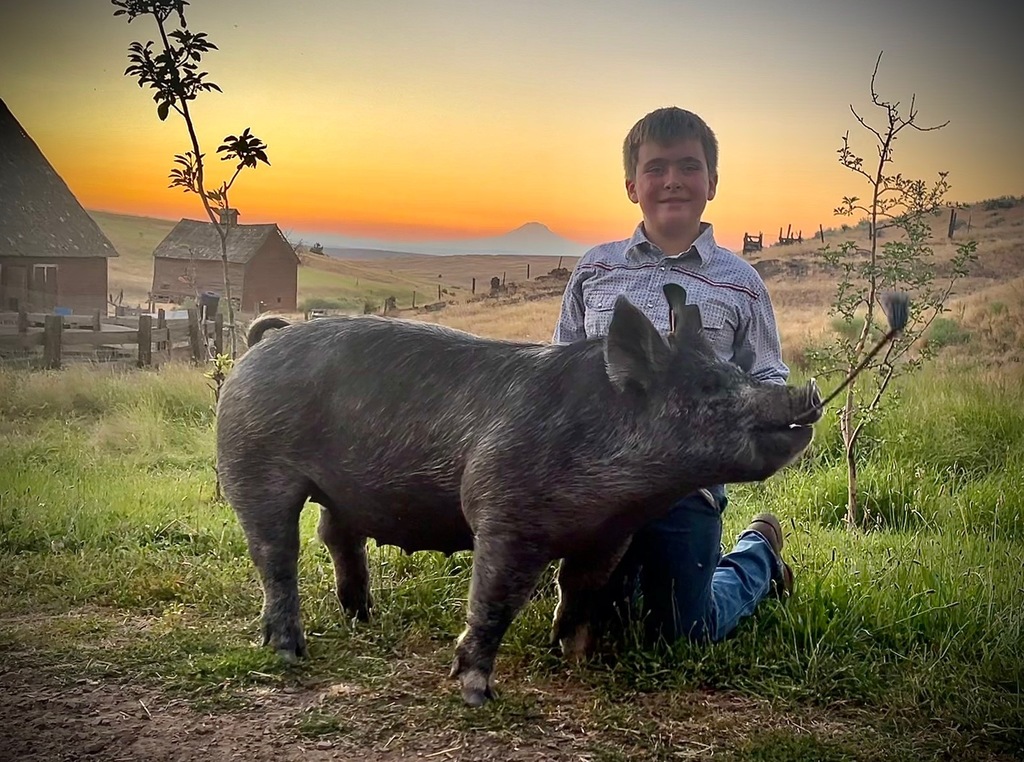 Keegan poses with his pig